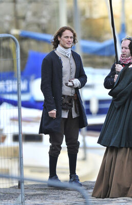 2015_-_Sam_Heughan_Caitriona_Balfe_and_Duncan_Lacroix_filming_07.jpg